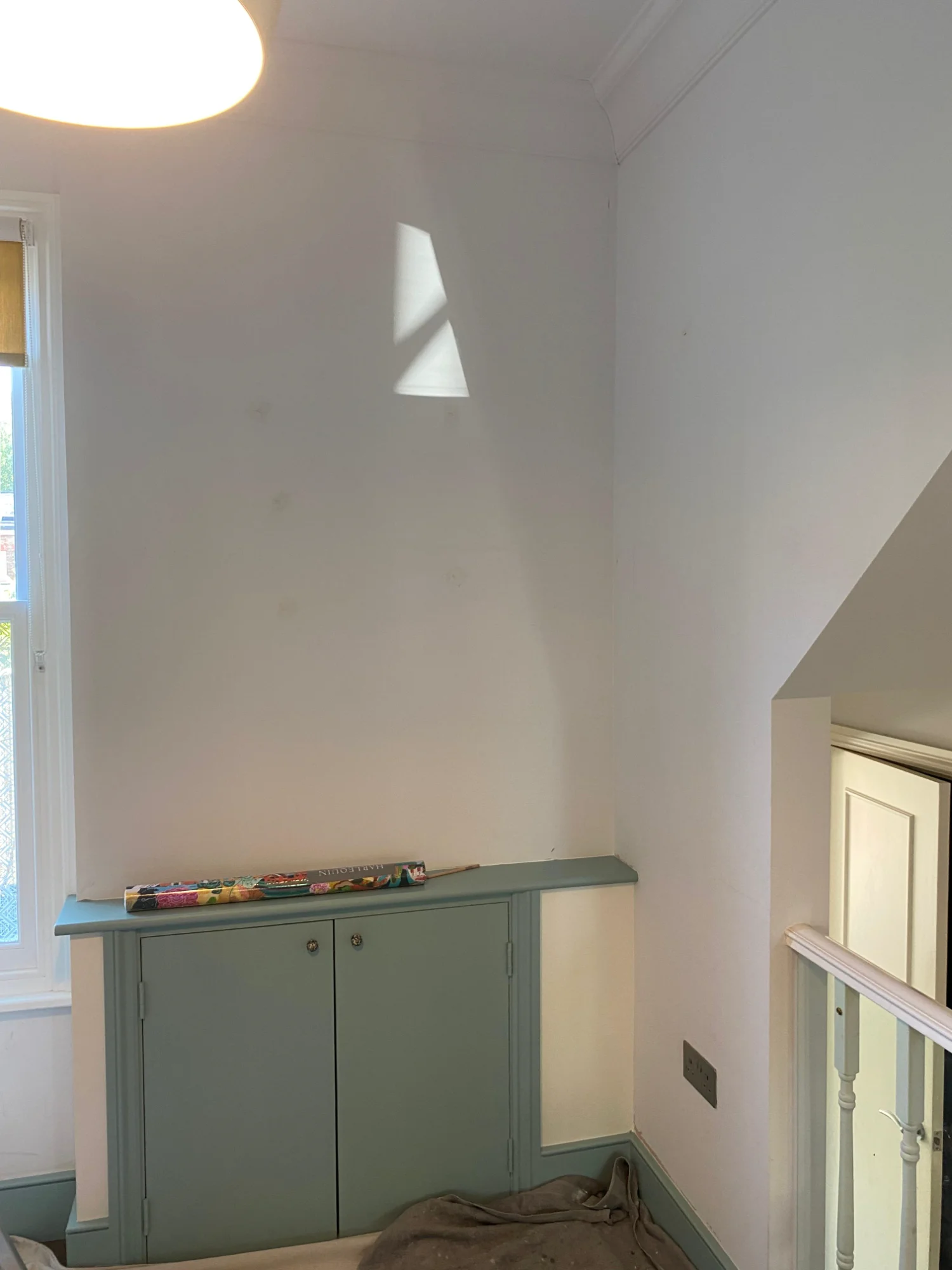 Hallway before wallpapering - plain white walls