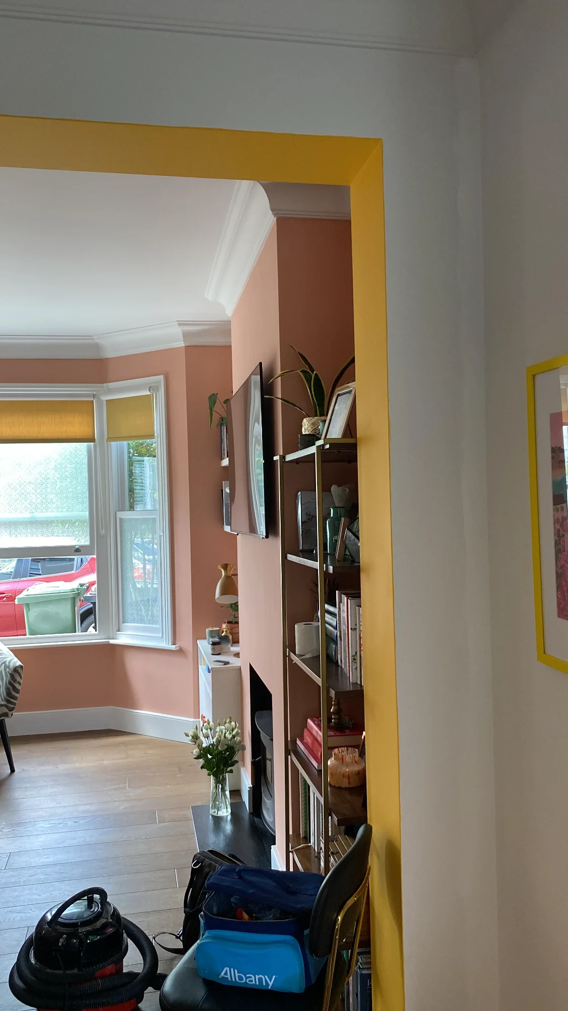 Wallpaper installation flowing through archway into living room