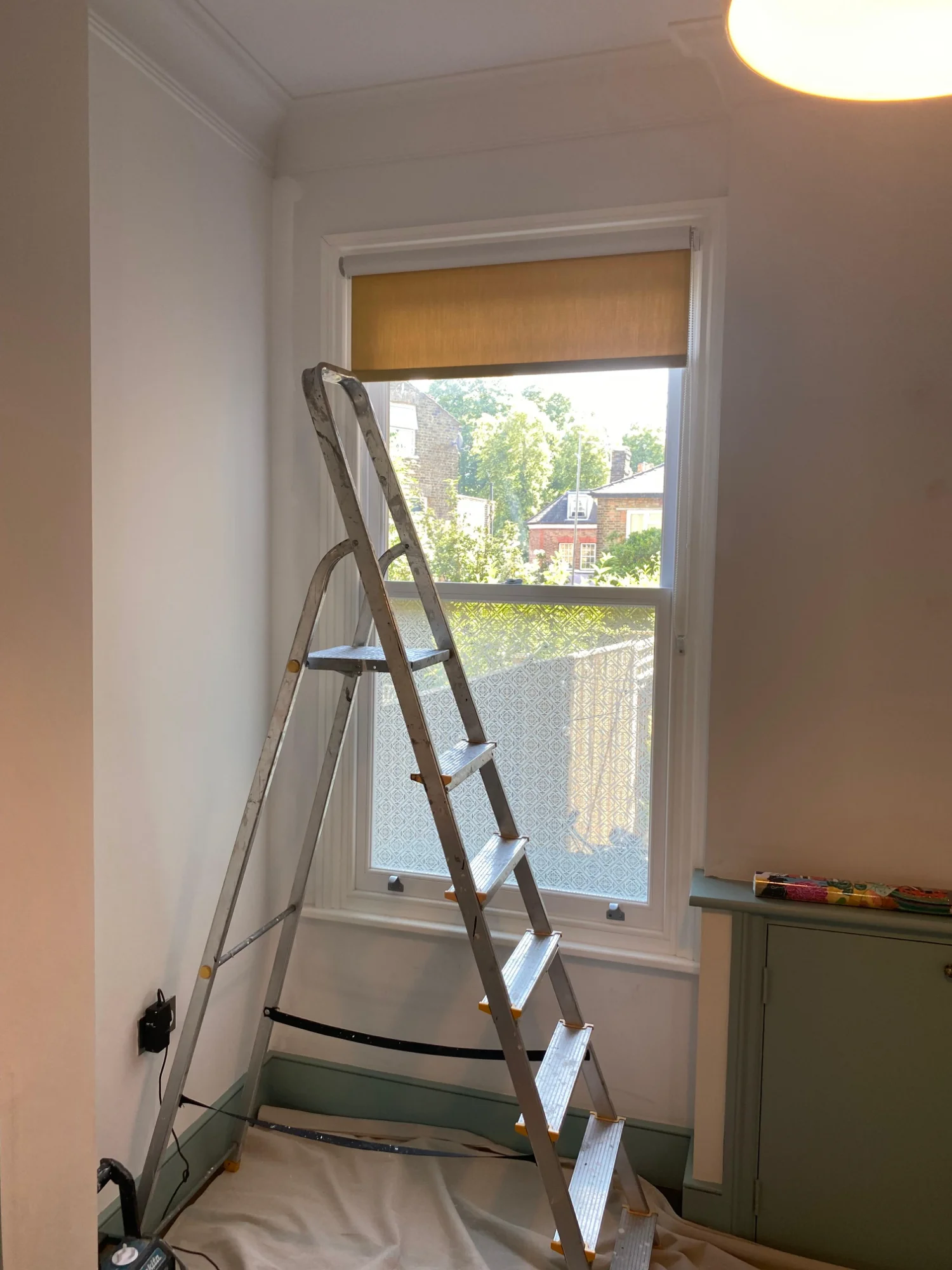 Completed specialist wallpaper installation in Victorian hallway with intricate pattern matching