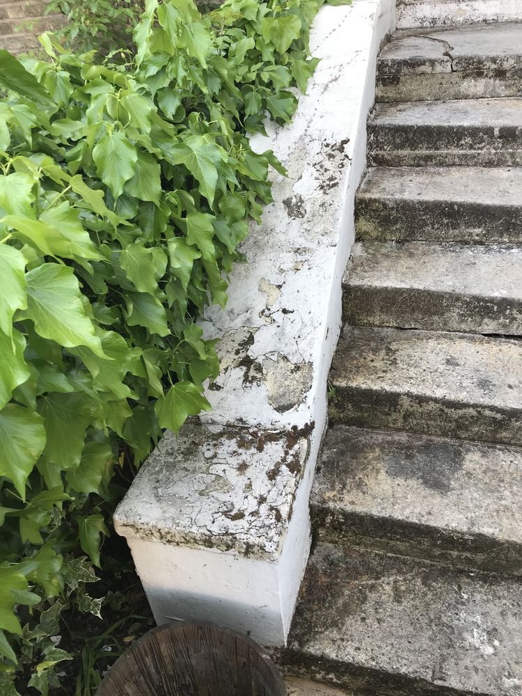 Exterior wall before painting - flaking and damaged paint