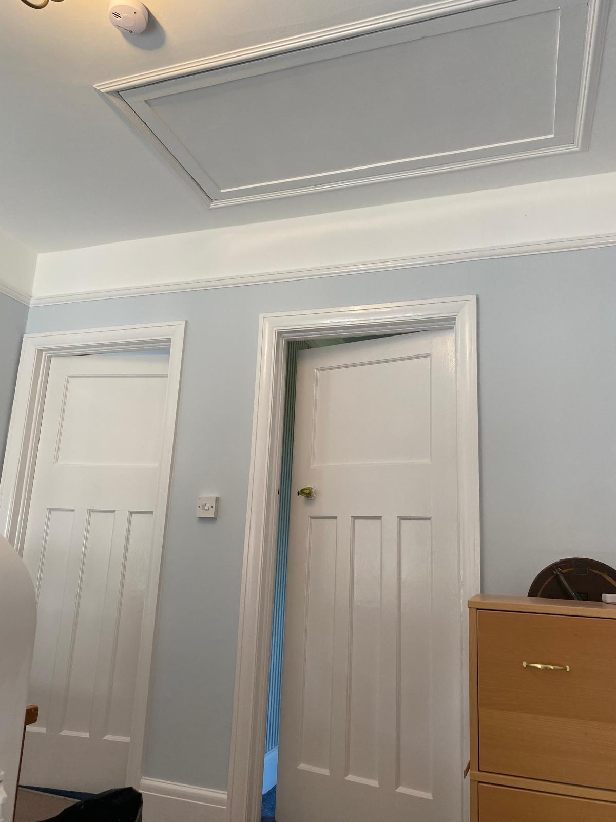 Bedroom after repainting in calming blue