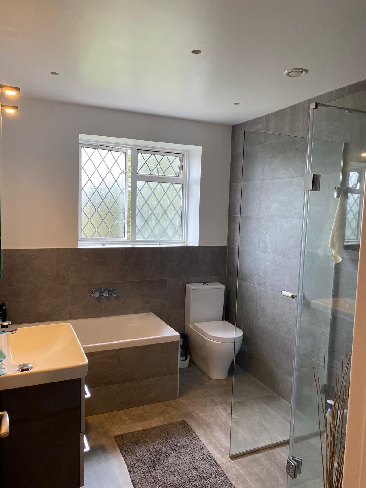 Modern bathroom with professional ceiling and wall painting in Basildon