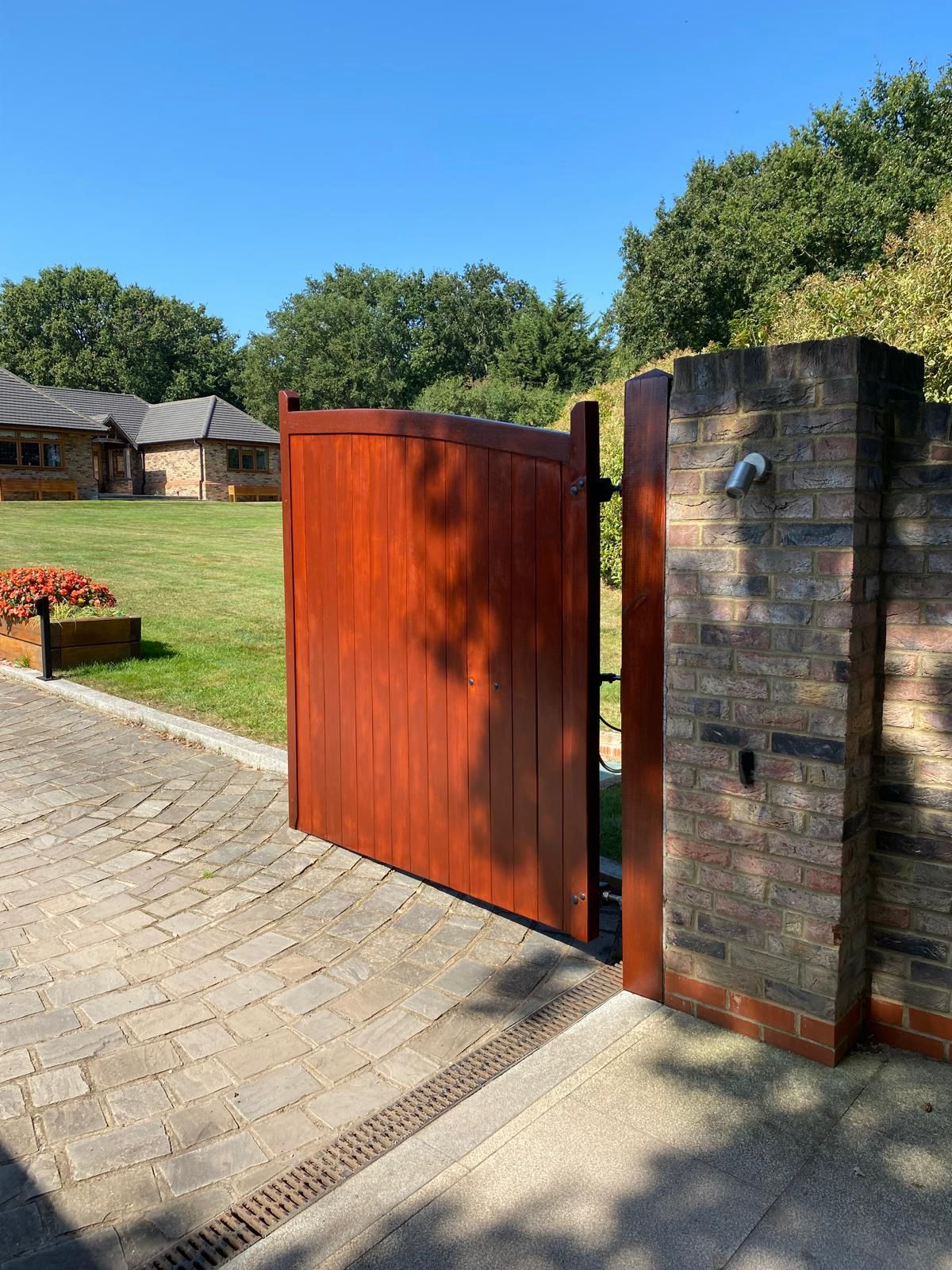 Close-up of professionally stained wooden pedestrian gate in Hockley, Essex