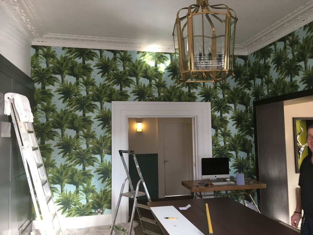 Tropical palm pattern wallpaper installed by Nolan decorators in Essex home office
