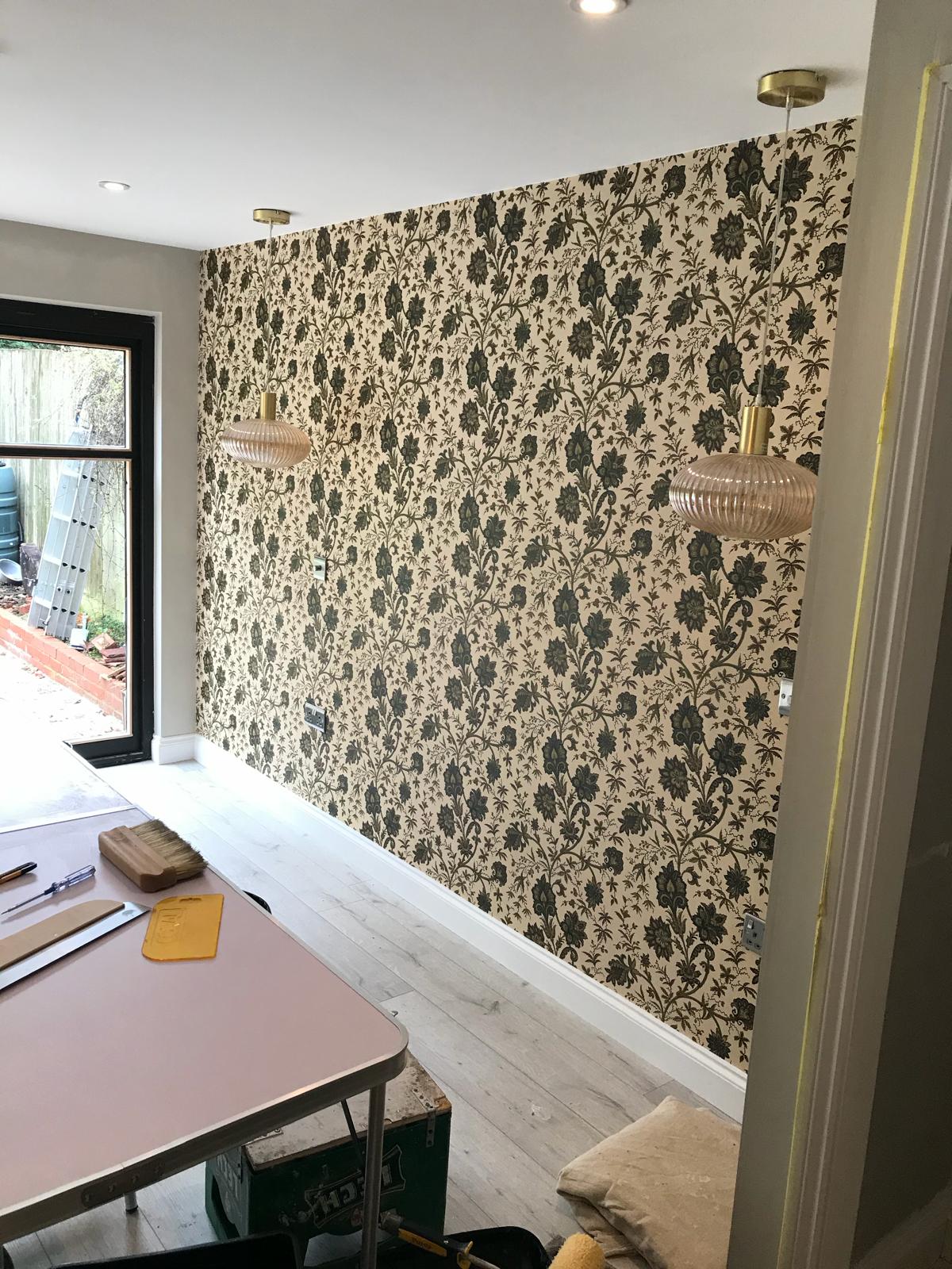 Dark floral wallpaper installed