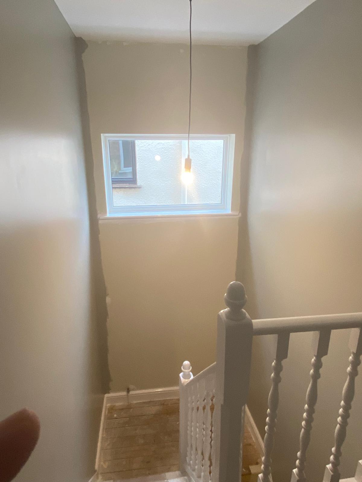 Stairwell before geometric wallpaper